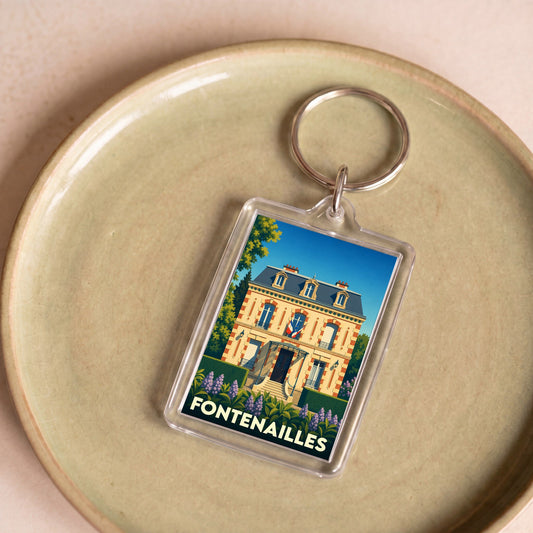 Porte-clés souvenir de la ville de Fontenailles avec une illustration stylisée de sa mairie.