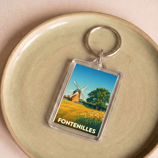 Porte-clés souvenir de la ville de Fontenilles avec une illustration stylisée d'un moulin.