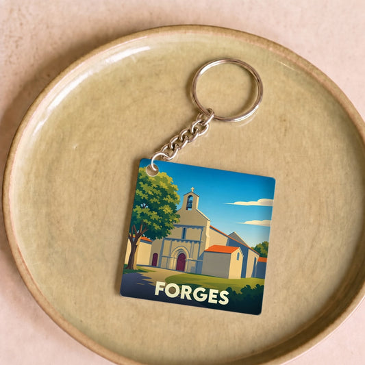 Porte-clés souvenir de la ville de Forges avec une illustration stylisée.