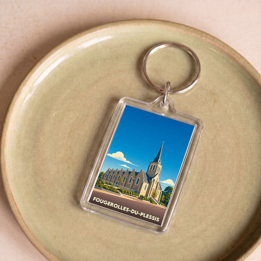 Porte-clés souvenir de la ville de Fougerolles-du-Plessis avec une illustration stylisée de son église.