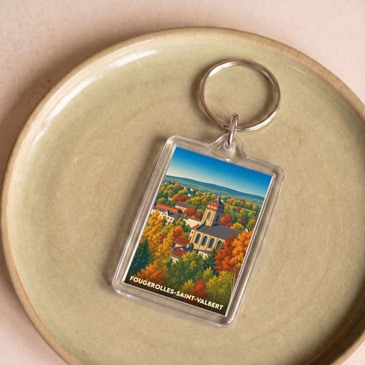 Porte-clés souvenir de la ville de Fougerolles-Saint-Valbert avec une illustration stylisée de son église en automne.