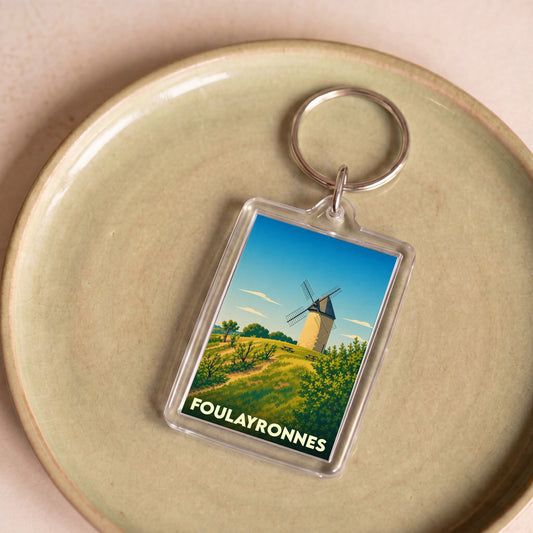 Porte-clés souvenir de la ville de Foulayronnes avec une illustration stylisée d'un moulin.