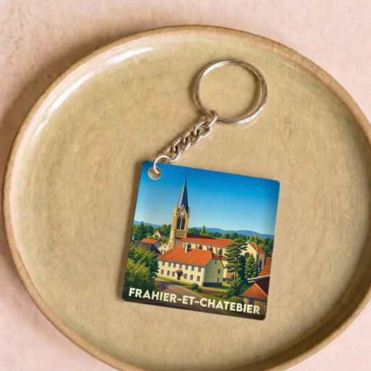 Porte-clés souvenir de la ville de Frahier-et-Chatebier avec une illustration stylisée.