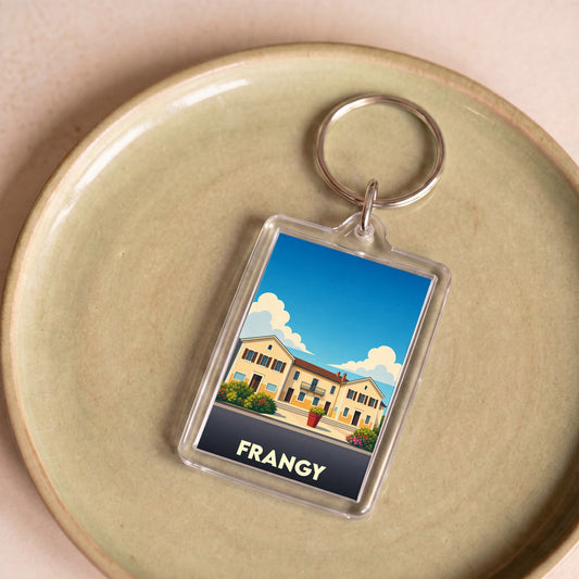Porte-clés souvenir de la ville de Frangy avec une illustration stylisée.