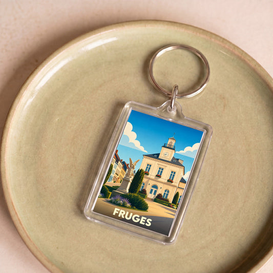 Porte-clés souvenir de la ville de Fruges avec une illustration stylisée de son hôtel de ville.