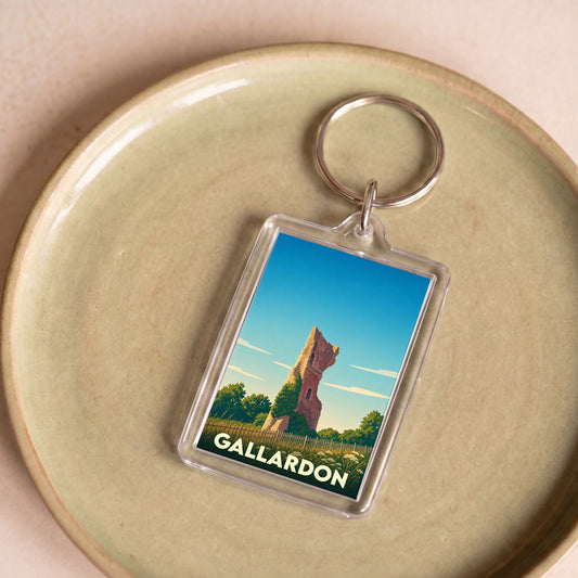 Porte-clés souvenir de la ville de Gallardon avec une illustration stylisée d'une tour en ruine.