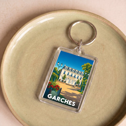 Porte-clés souvenir de la ville de Garches avec une illustration stylisée.