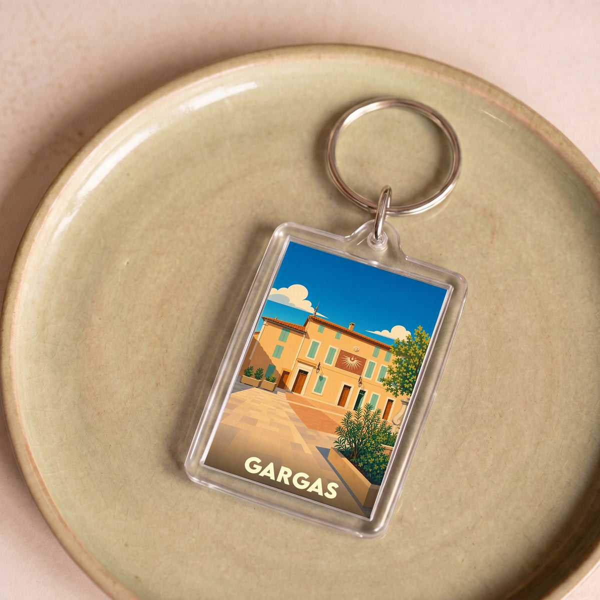Porte-clés souvenir de la ville de Gargas avec une illustration stylisée.