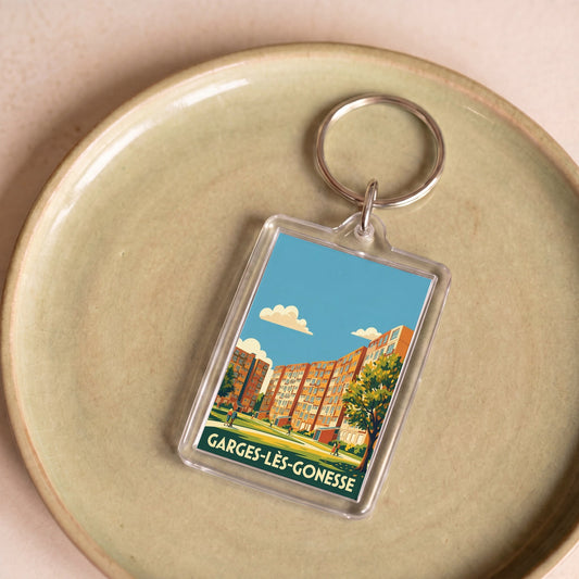 Porte-clés souvenir de la ville de Garges-lès-Gonesse avec une illustration stylisée.