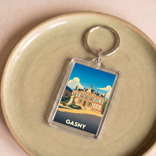 Porte-clés souvenir de la ville de Gasny avec une illustration stylisée de son hôtel de ville.