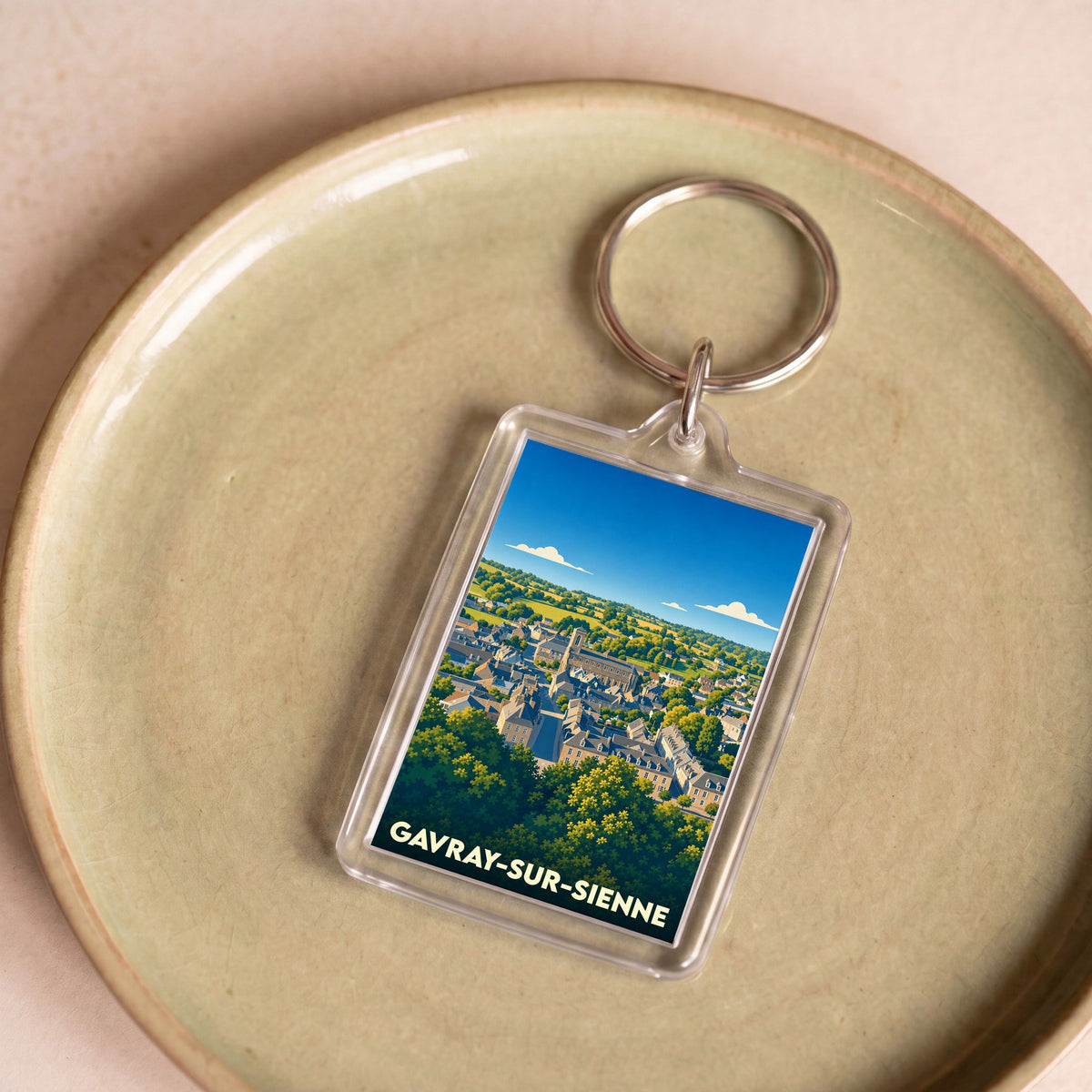 Porte-clés souvenir de la ville de Gavray-sur-Sienne avec une illustration stylisée.