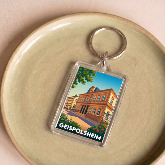 Porte-clés souvenir de la ville de Geispolsheim avec une illustration stylisée.