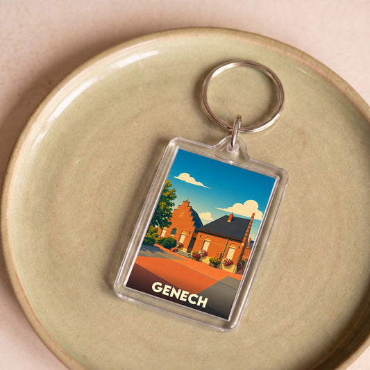 Porte-clés souvenir de la ville de Genech avec une illustration stylisée d'une maison traditionnelle.
