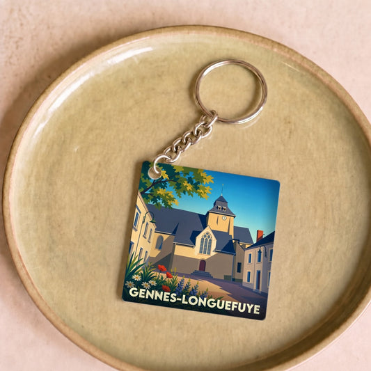 Porte-clés souvenir de la ville de Gennes-Longuefuye avec une illustration stylisée.