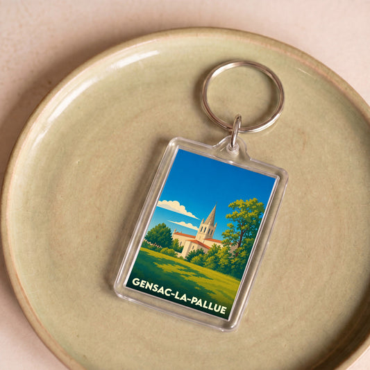 Porte-clés souvenir de la ville de Gensac-la-Pallue avec une illustration stylisée de son église.