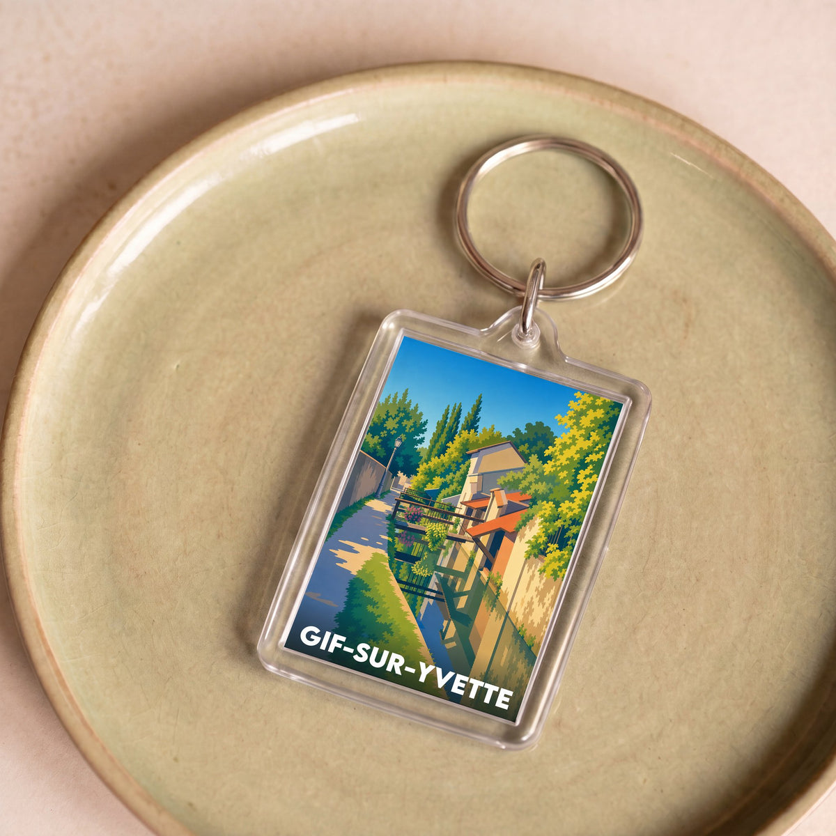 Porte-clés souvenir de la ville de Gif-sur-Yvette avec une illustration stylisée.