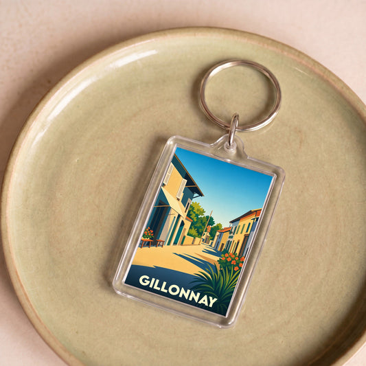 Porte-clés souvenir de la ville de Gillonnay avec une illustration stylisée.