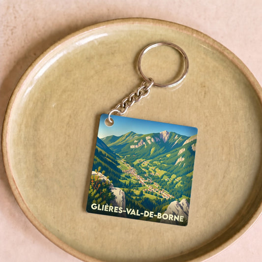Porte-clés souvenir de la ville de Glières-Val-de-Borne avec une illustration stylisée de ses paysages montagneux.