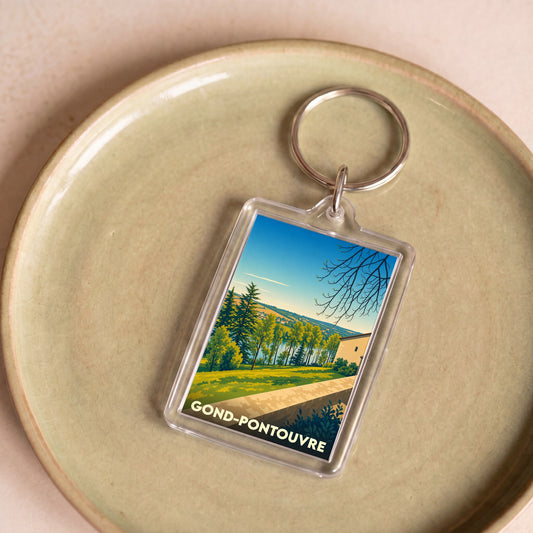 Porte-clés souvenir de Gond-Pontouvre avec une illustration de paysage stylisée.