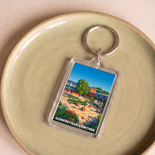 Porte-clés souvenir de la ville de Gonfreville-l'Orcher avec une illustration stylisée.