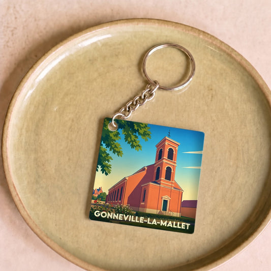 Porte-clés souvenir de la ville de Gonneville-la-Mallet avec une illustration stylisée de son église.