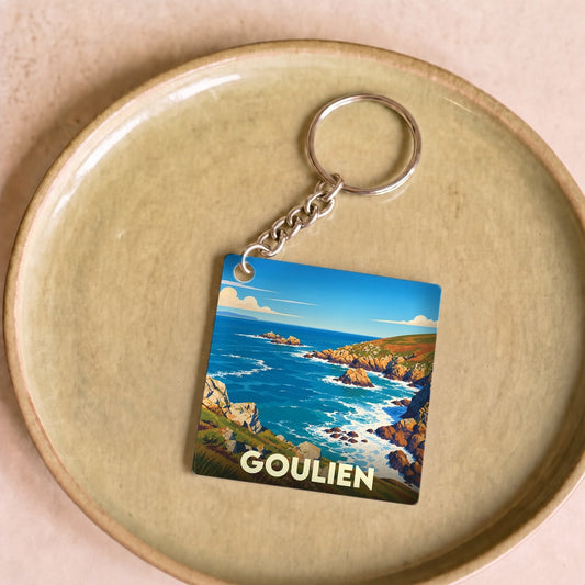 Porte-clés souvenir de la ville de Goulien illustré d'un paysage côtier stylisé.