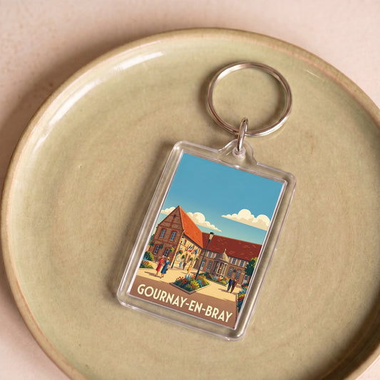 Porte-clés souvenir de la ville de Gournay-en-Bray avec une illustration stylisée.