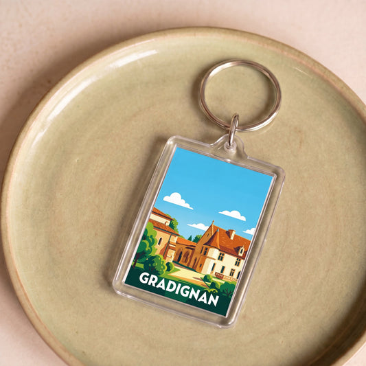 Porte-clés souvenir de la ville de Gradignan avec une illustration stylisée.