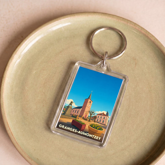 Porte-clés souvenir de la ville de Granges-Aumontzey avec une illustration stylisée.