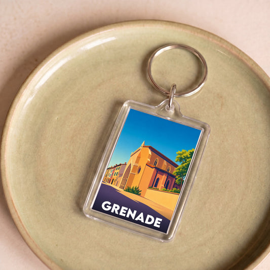 Porte-clés souvenir de la ville de Grenade avec une illustration stylisée d'un monument historique.