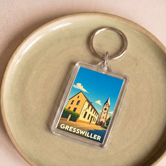 Porte-clés souvenir de la ville de Gresswiller avec une illustration stylisée.
