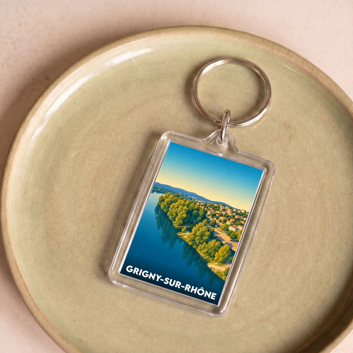 Porte-clés souvenir de la ville de Grigny-sur-Rhône avec une illustration stylisée.