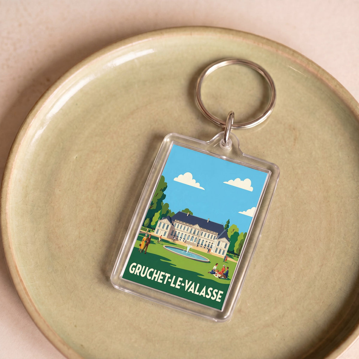 Porte-clés souvenir de la ville de Gruchet-le-Valasse avec une illustration stylisée.