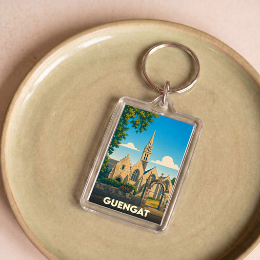 Porte-clés souvenir de la ville de Guengat avec une illustration stylisée de son église.