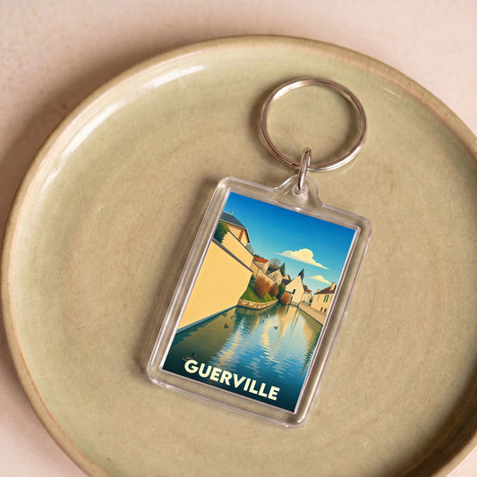 Porte-clés souvenir de la ville de Guerville avec une illustration stylisée d'un canal et de maisons.