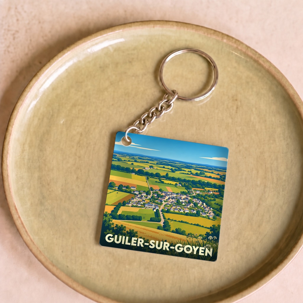 Porte-clés souvenir de la ville de Guiler-sur-Goyen avec une illustration panoramique stylisée.