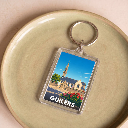 Porte-clés souvenir de la ville de Guilers avec une illustration stylisée.