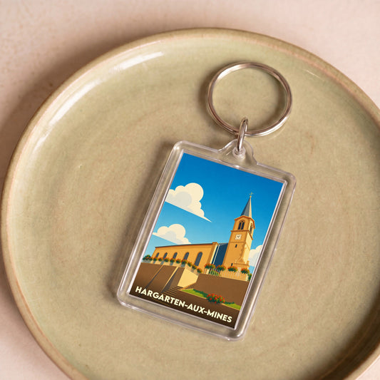Porte-clés souvenir de la ville de Hargarten-aux-Mines avec une illustration stylisée de son église.