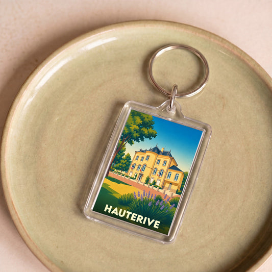 Porte-clés souvenir de la ville de Hauterive avec une illustration stylisée.