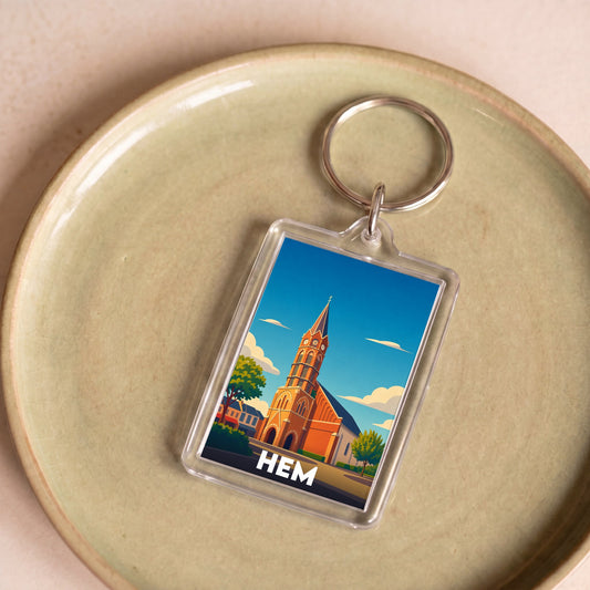 Porte-clés souvenir de la ville de Hem avec une illustration stylisée.