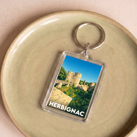 Porte-clés souvenir de la ville de Herbignac avec une illustration stylisée de son château.