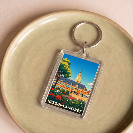 Porte-clés souvenir de la ville de Hesdin-la-Forêt avec une illustration stylisée de l'hôtel de ville.
