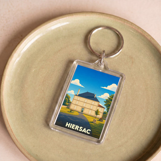 Porte-clés souvenir de la ville de Hiersac avec une illustration stylisée d'une demeure historique.