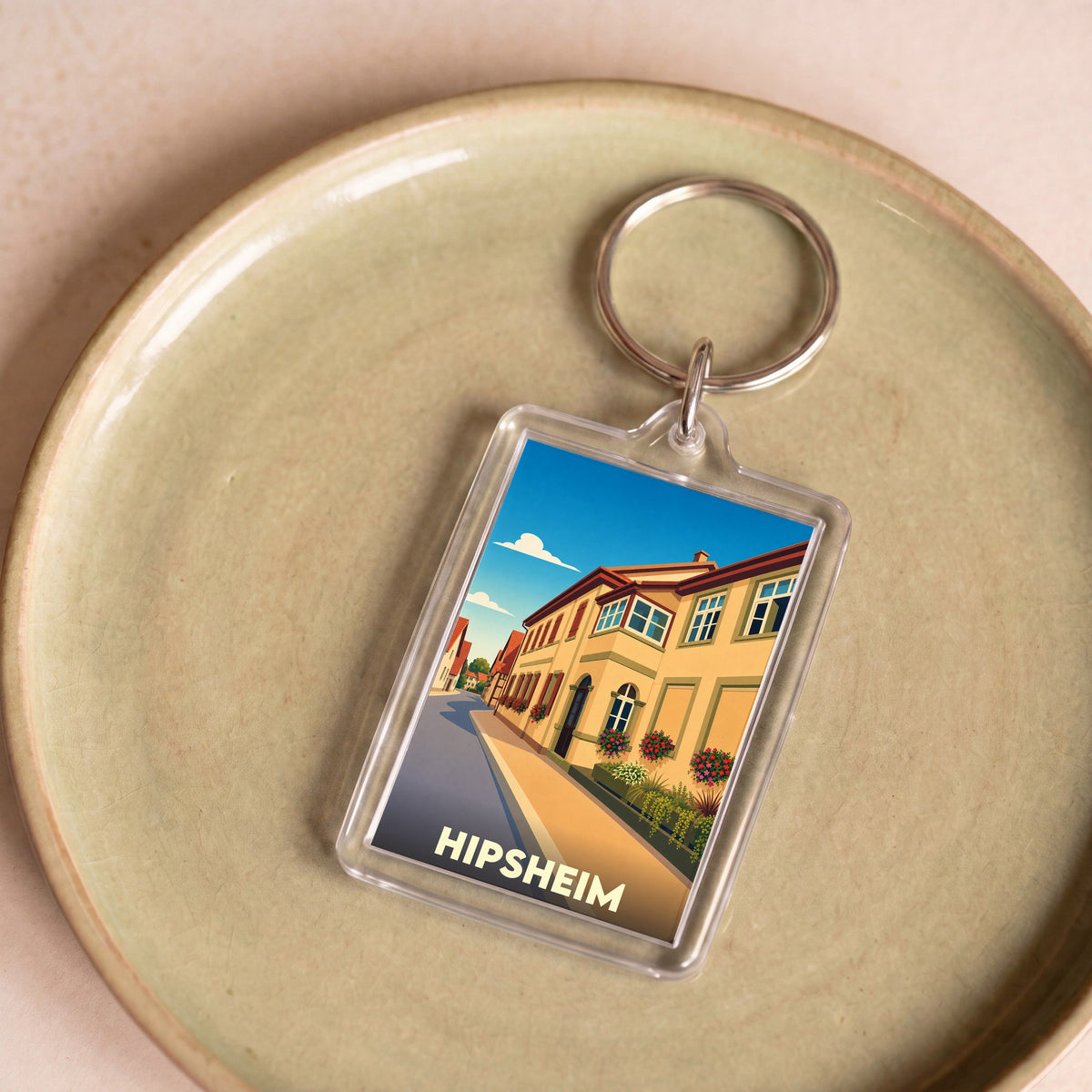 Porte-clés souvenir de la ville de Hipsheim avec une illustration stylisée.