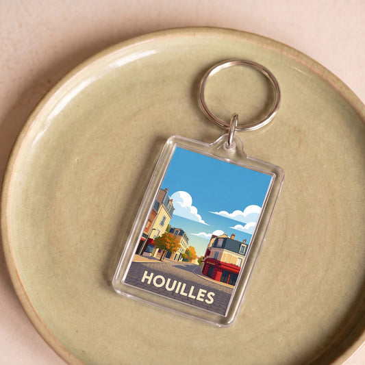 Porte-clés souvenir de la ville de Houilles avec une illustration stylisée.