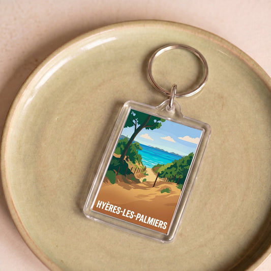 Porte-clés souvenir de la ville de Hyères-les-Palmiers avec une illustration stylisée.