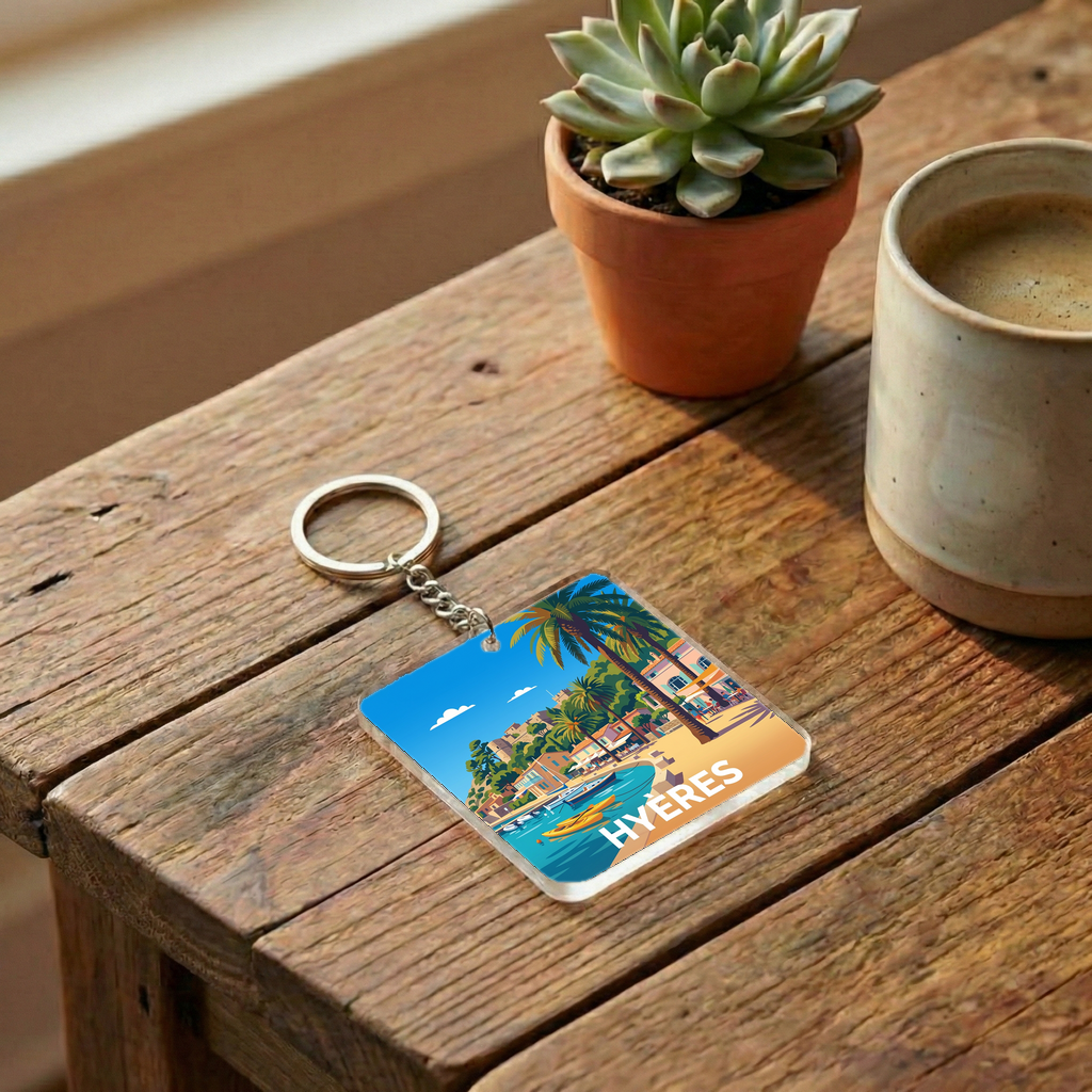 Porte-clés souvenir de la ville de Hyères avec une illustration stylisée.