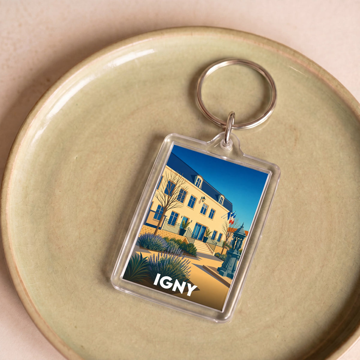 Porte-clés souvenir de la ville d'Igny avec une illustration stylisée de son hôtel de ville.
