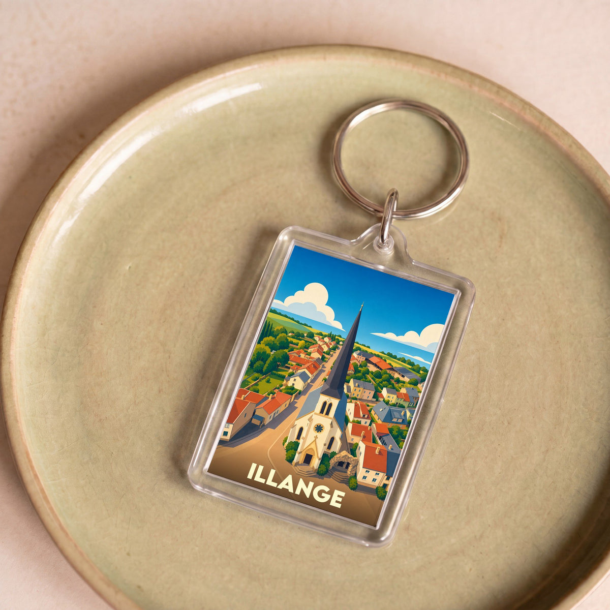Porte-clés souvenir de la ville de Illange avec une illustration stylisée.