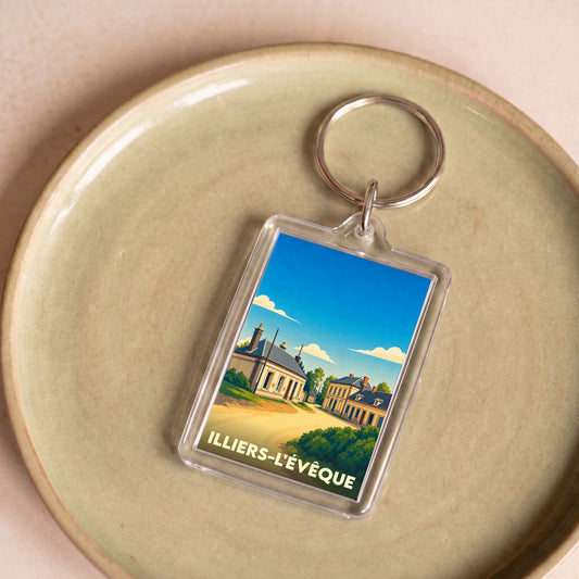 Porte-clés souvenir de la ville d'Illiers-l'Évêque avec une illustration stylisée.